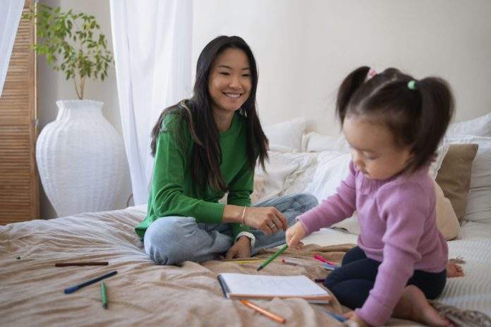 little-asian-girl-spending-time-home-with-her-mother (1)
